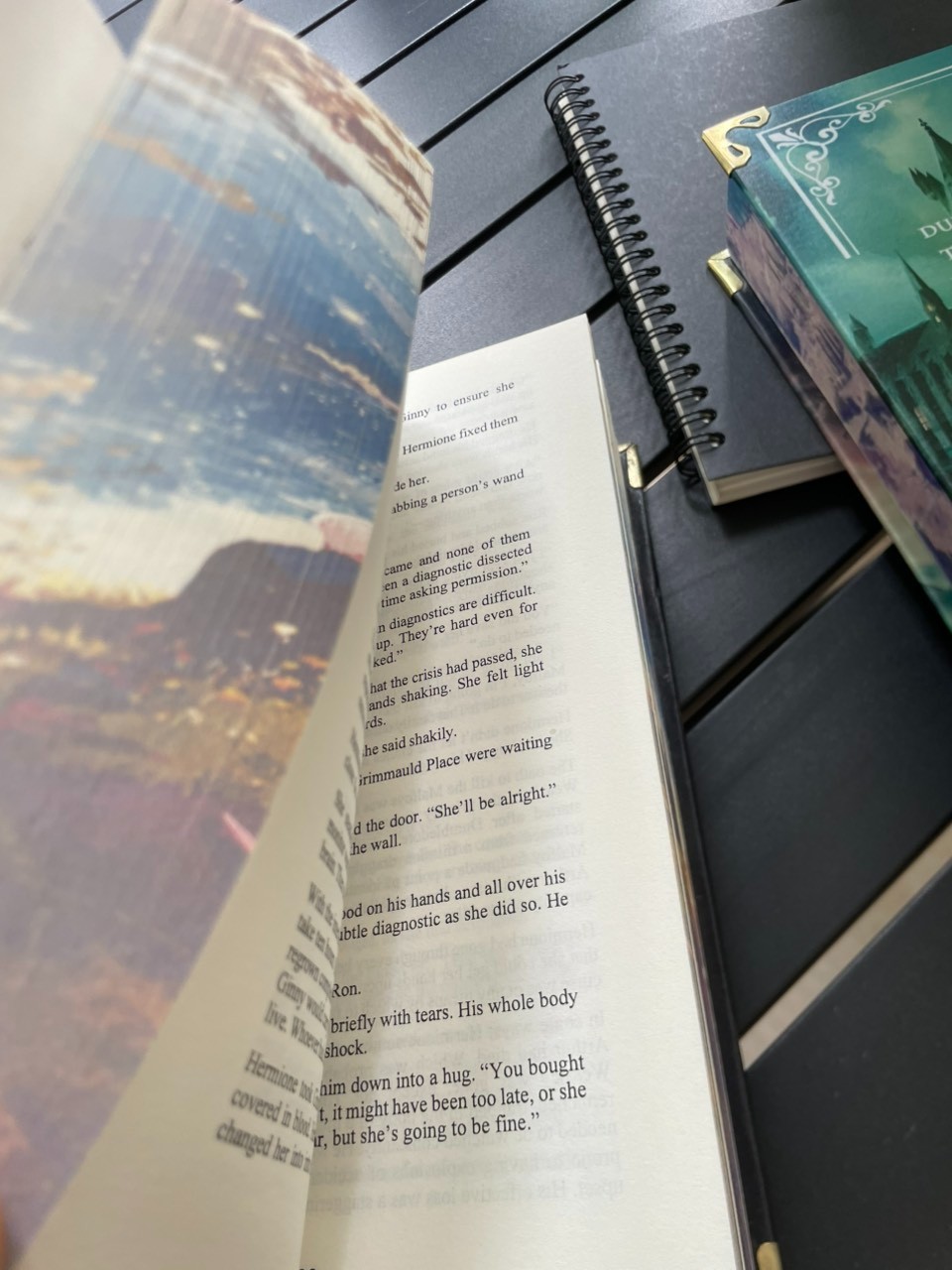 The limited edition hardcover novel Manacled (printed on three sides) collec