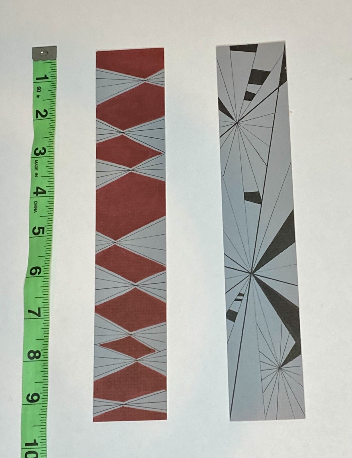 2 hand drawn geometric pattern bookmarks, roughly 2 in x 9.5 in