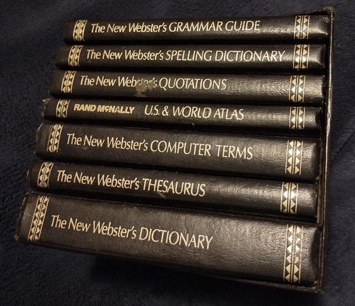 The New Webster&rsquo;s Library of Practical Information desktop set of 7. Aged.